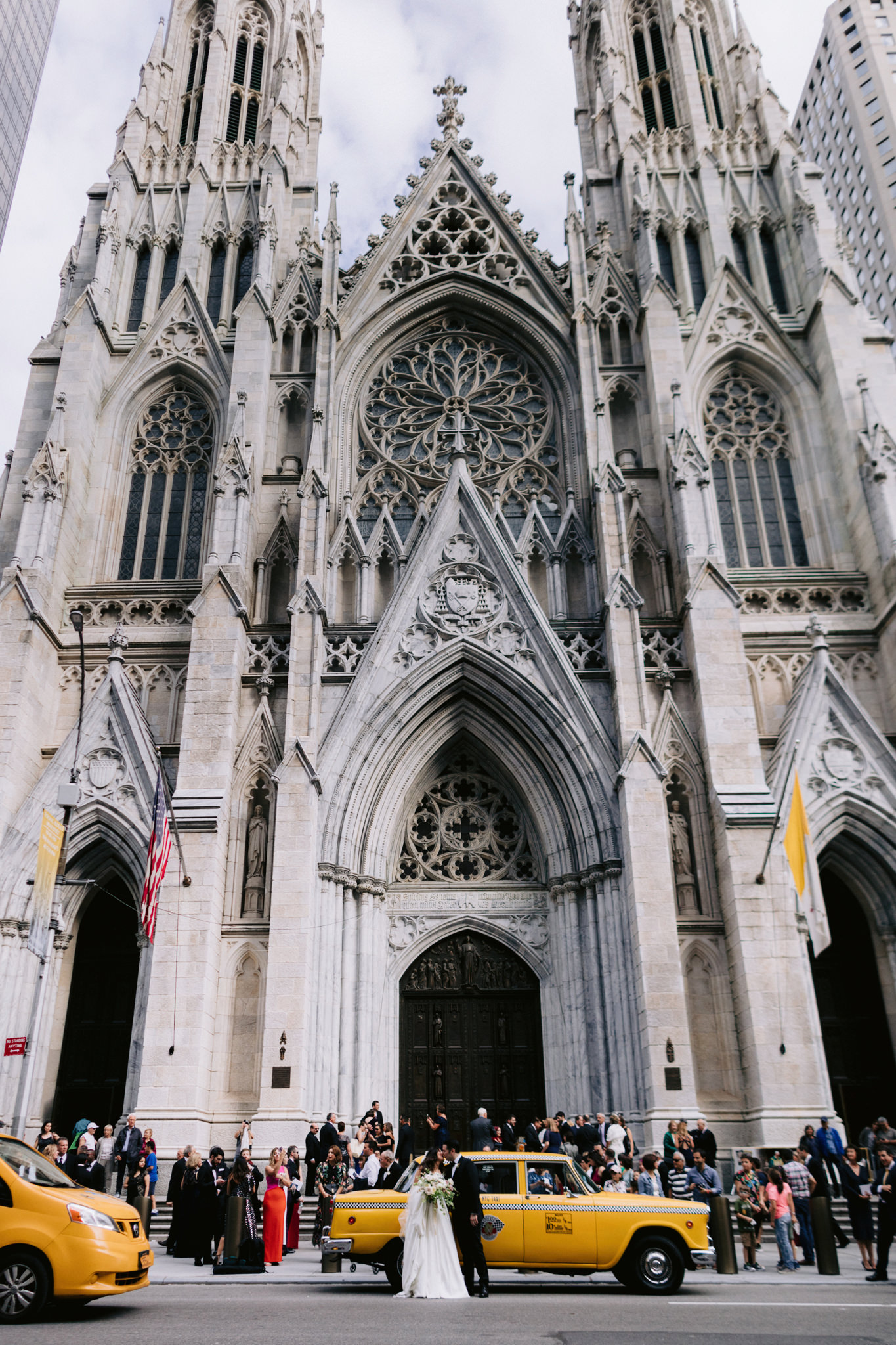 Bride and groom kissing out side of St.Patrick's Cathedral