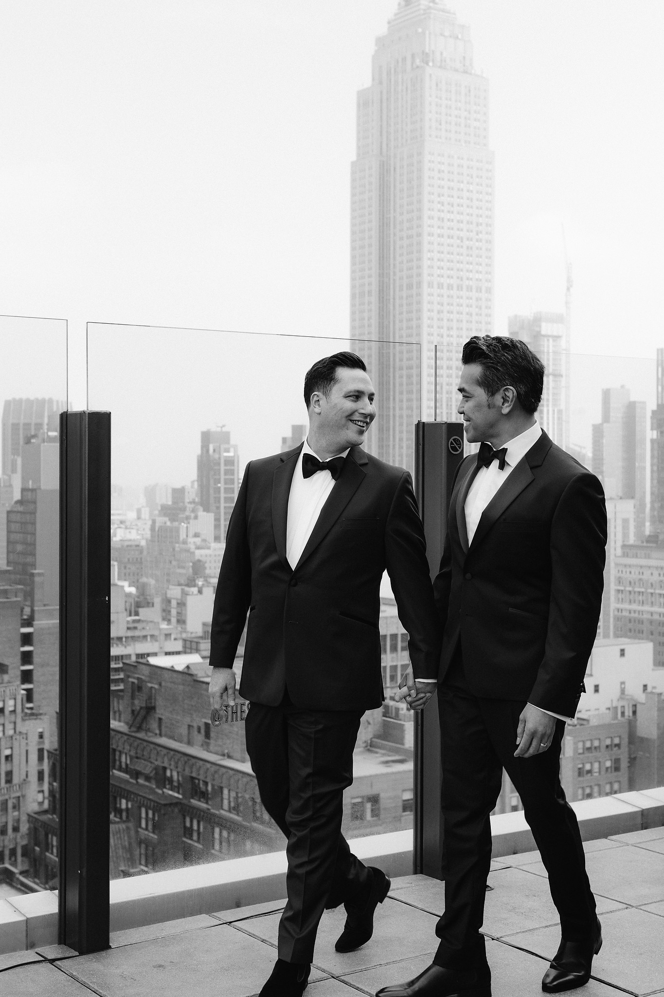 Husband and husband holding hands on their wedding day
