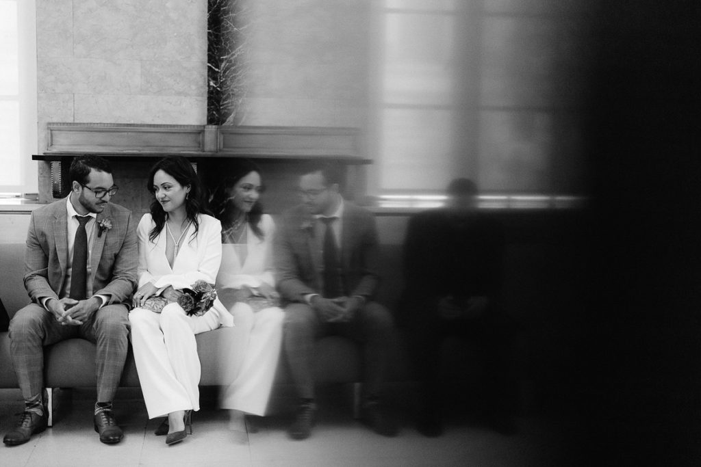a man and a woman for their turn to get married at New York City Hall. Photo by Jenny Fu
