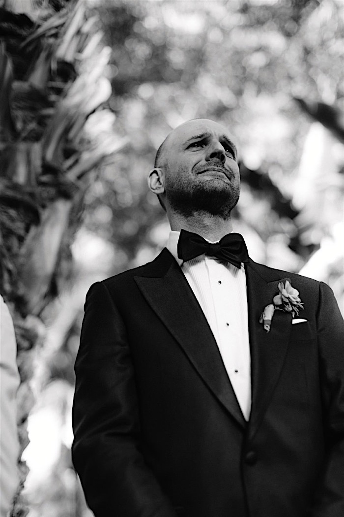 Groom tearing up when seeing his bride walk down the aisle.
