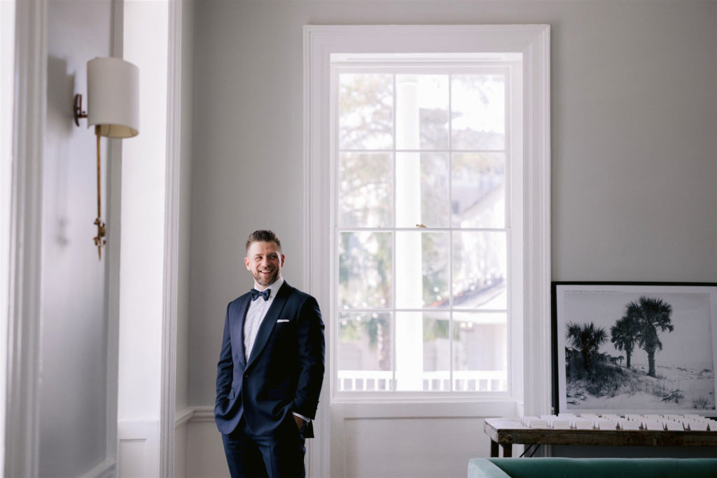 groom smiling before wedding