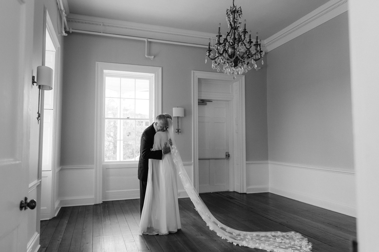 father of the bride embracing his daughter