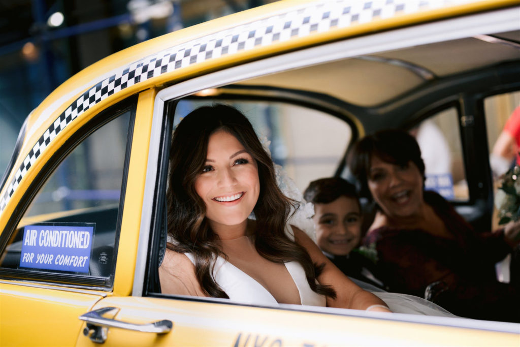 old new york, new york wedding, jenny fu, bride, vintage taxi, classic new york wedding, beautiful bride looks out car window, film cars New York, checker cab, Manhattan wedding