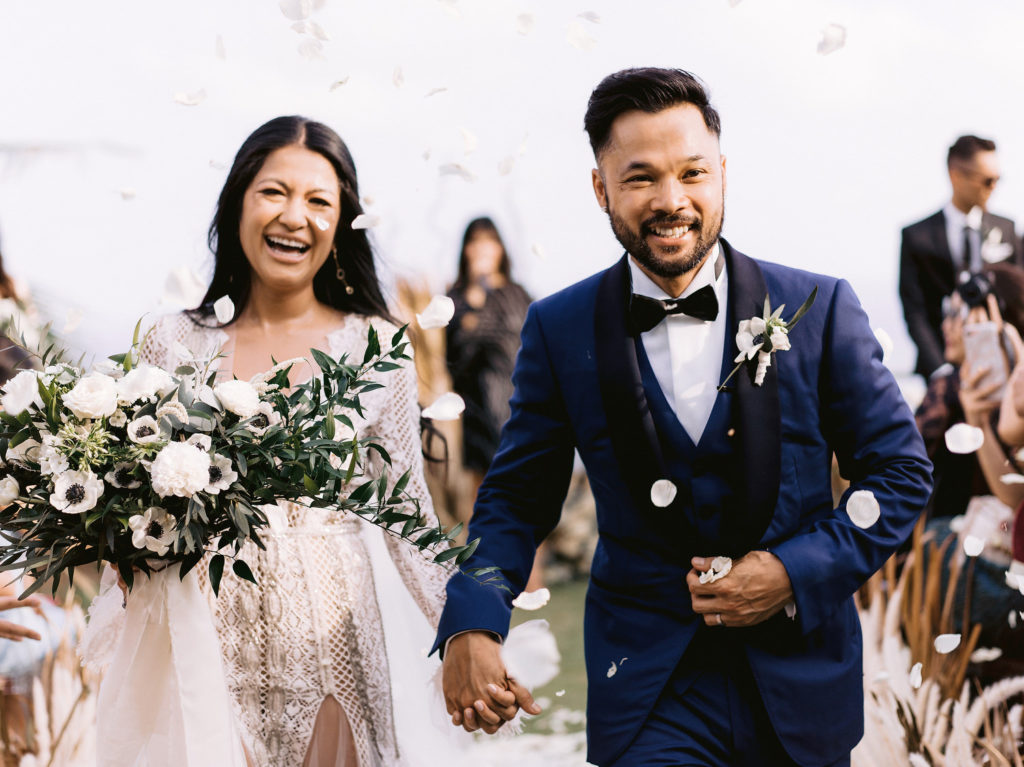 Jenifer and June smiling, bride, groom