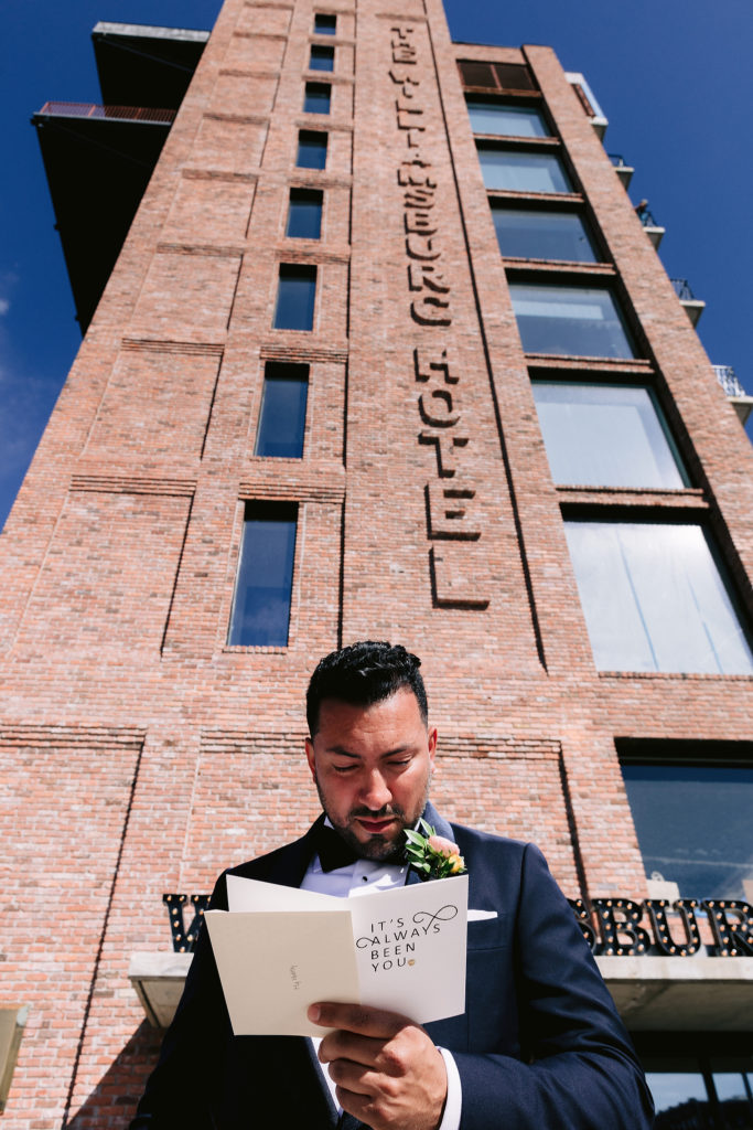 groom reading vows, love letters, postponed wedding