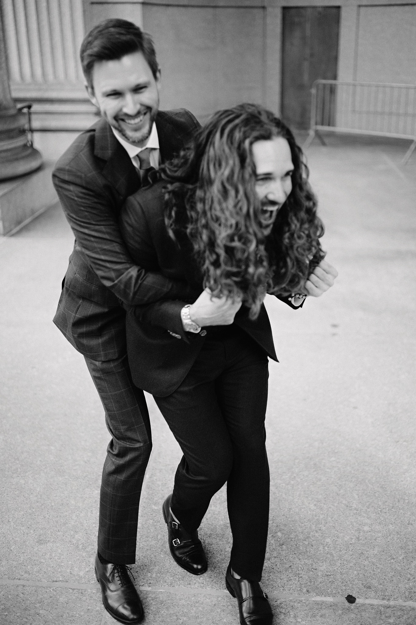 Two men embracing after their marriage, same sex wedding