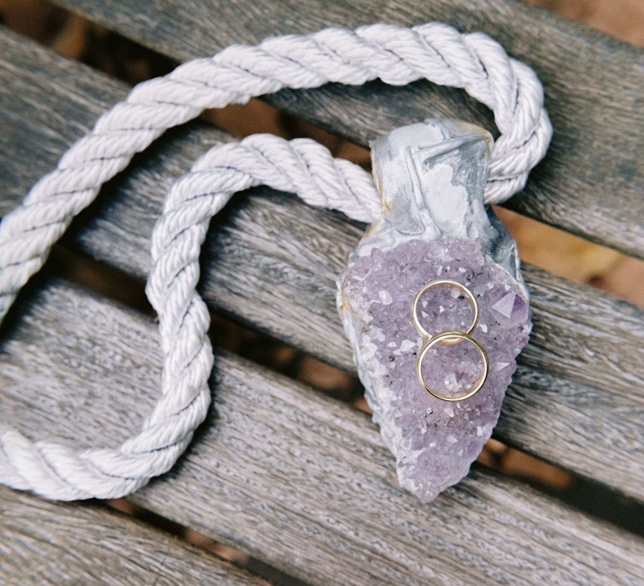 Husband and husband rings on a crystal necklace