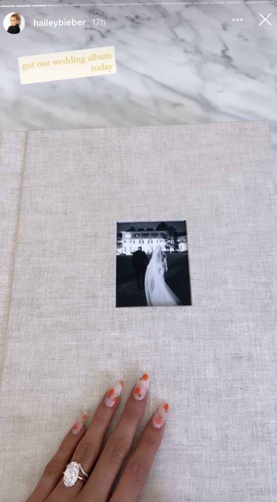 Hailey Bieber viewing her heirloom wedding album