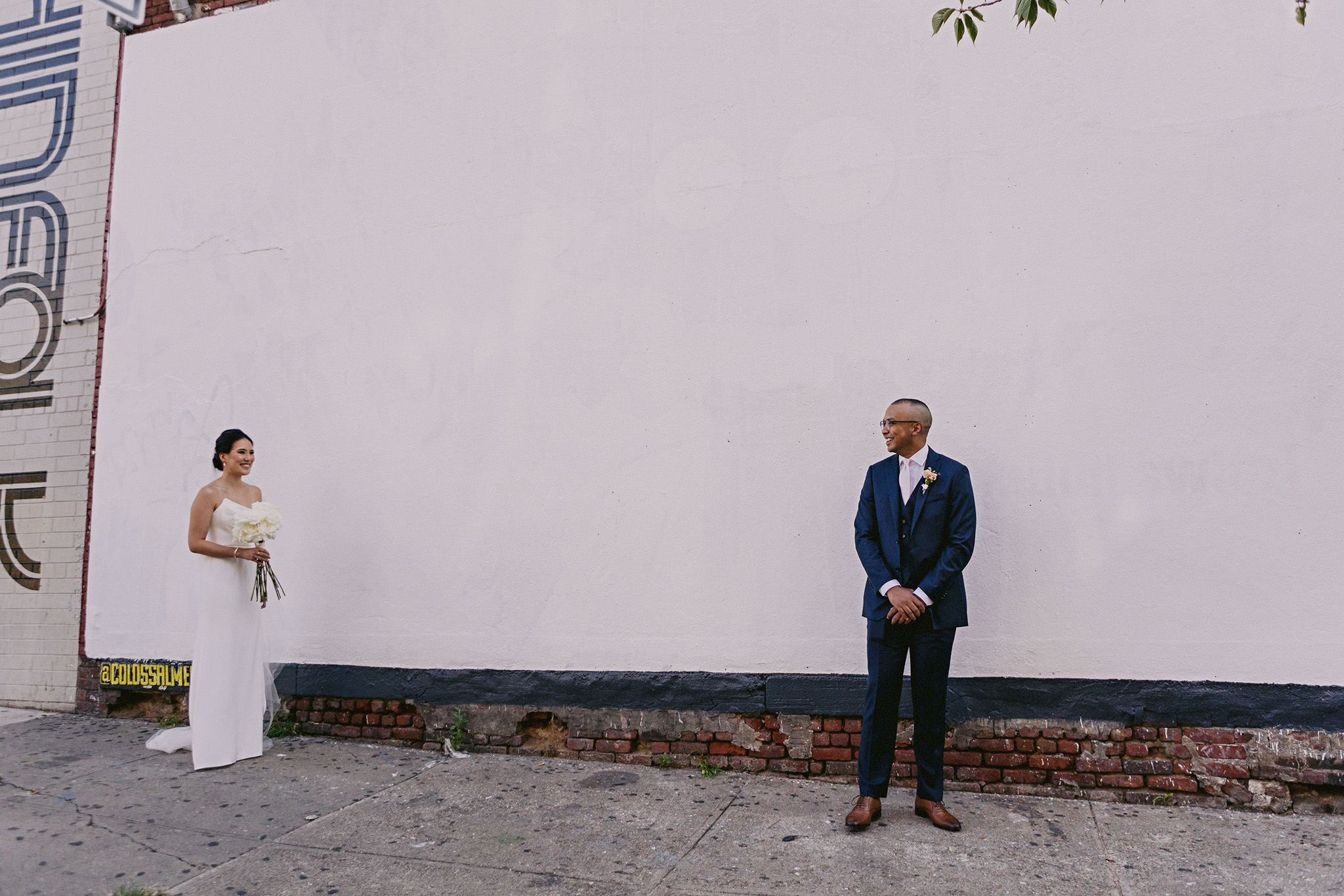 Bride holding her bouquet seeing her groom for the first time on their wedding day