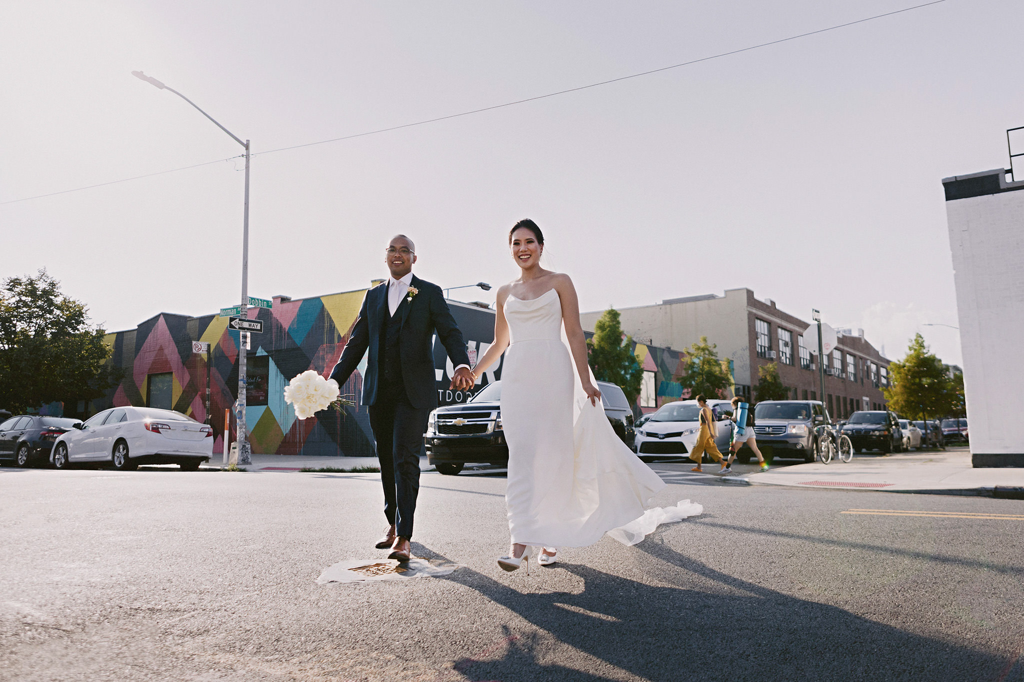 husband and wife walking down Dobbin Street