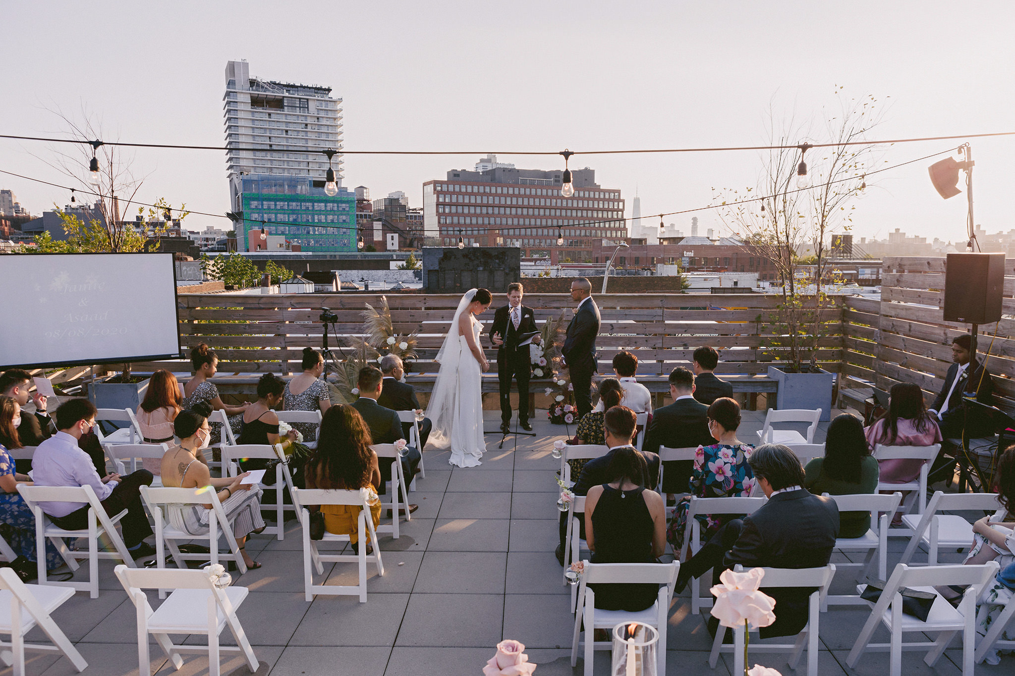 Man and woman sharing their wedding vows on the rooftop at Dobbin Street