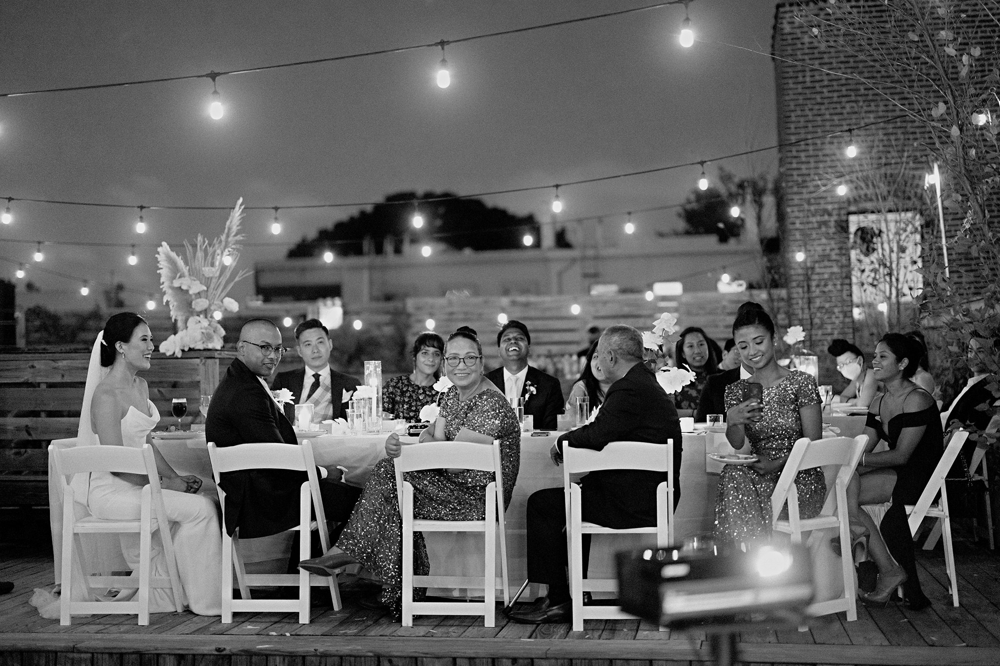 Micro wedding guests enjoying dinner on the rooftop at Dobbin St