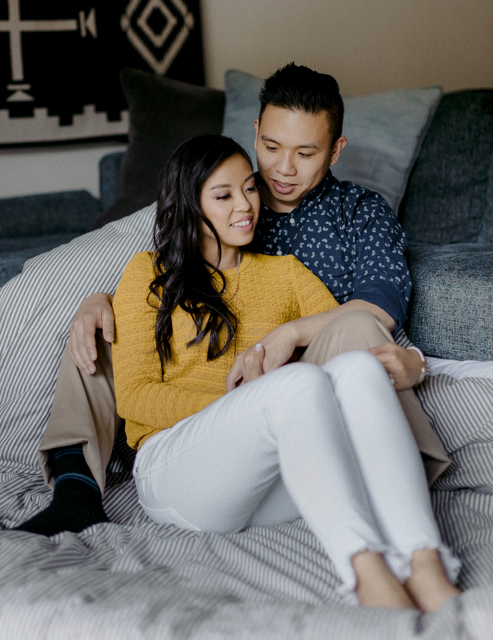 Couple snuggling on the couch