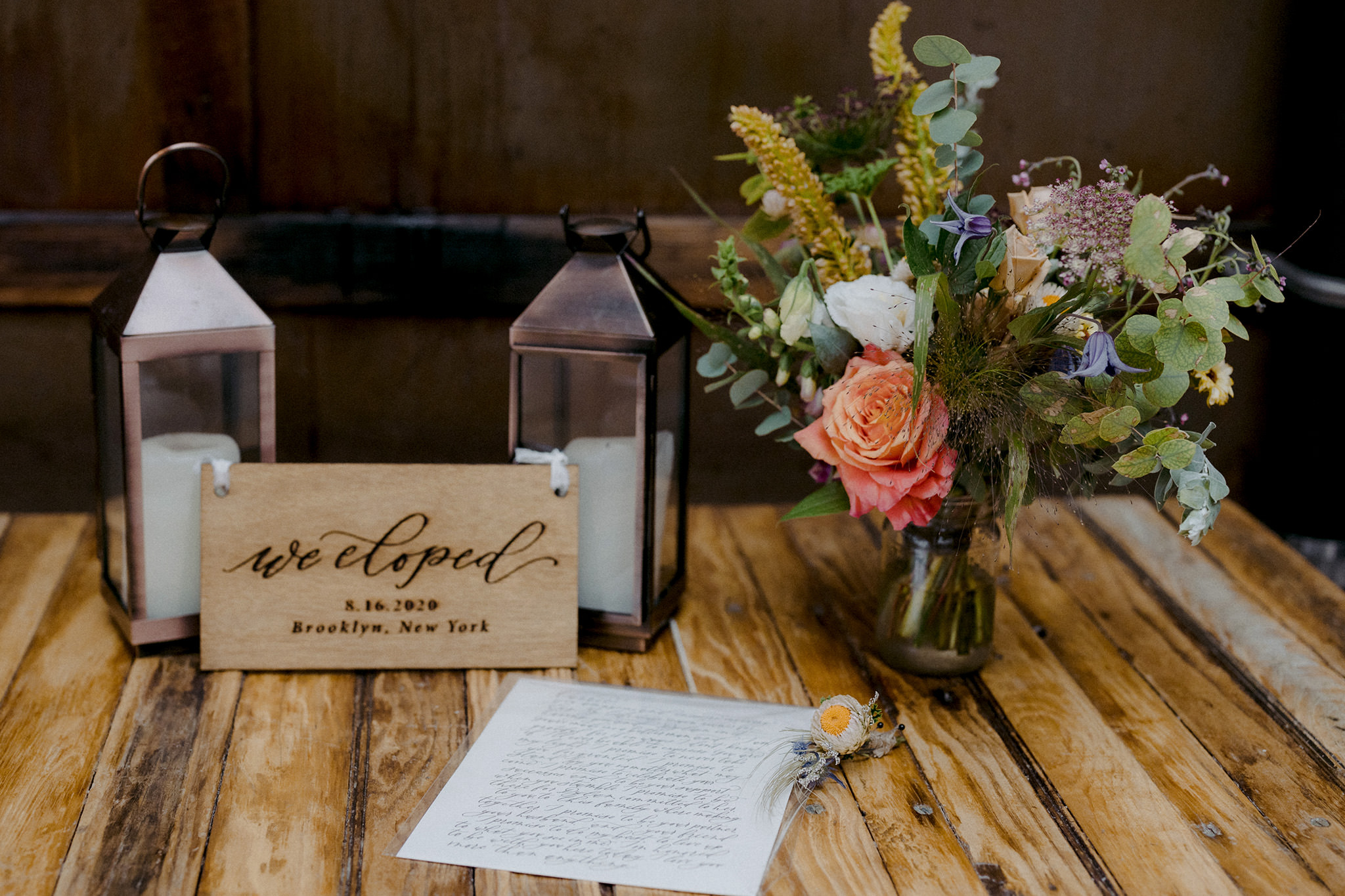 Organic wedding bouquet with hand written wedding vows and candles
