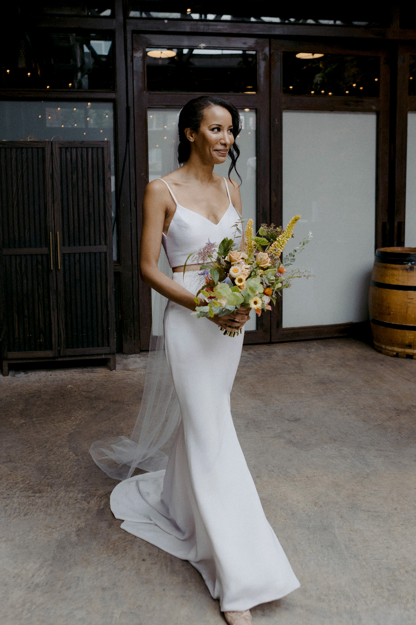 Bride walking down the aisle in Brooklyn at the Brooklyn Winery