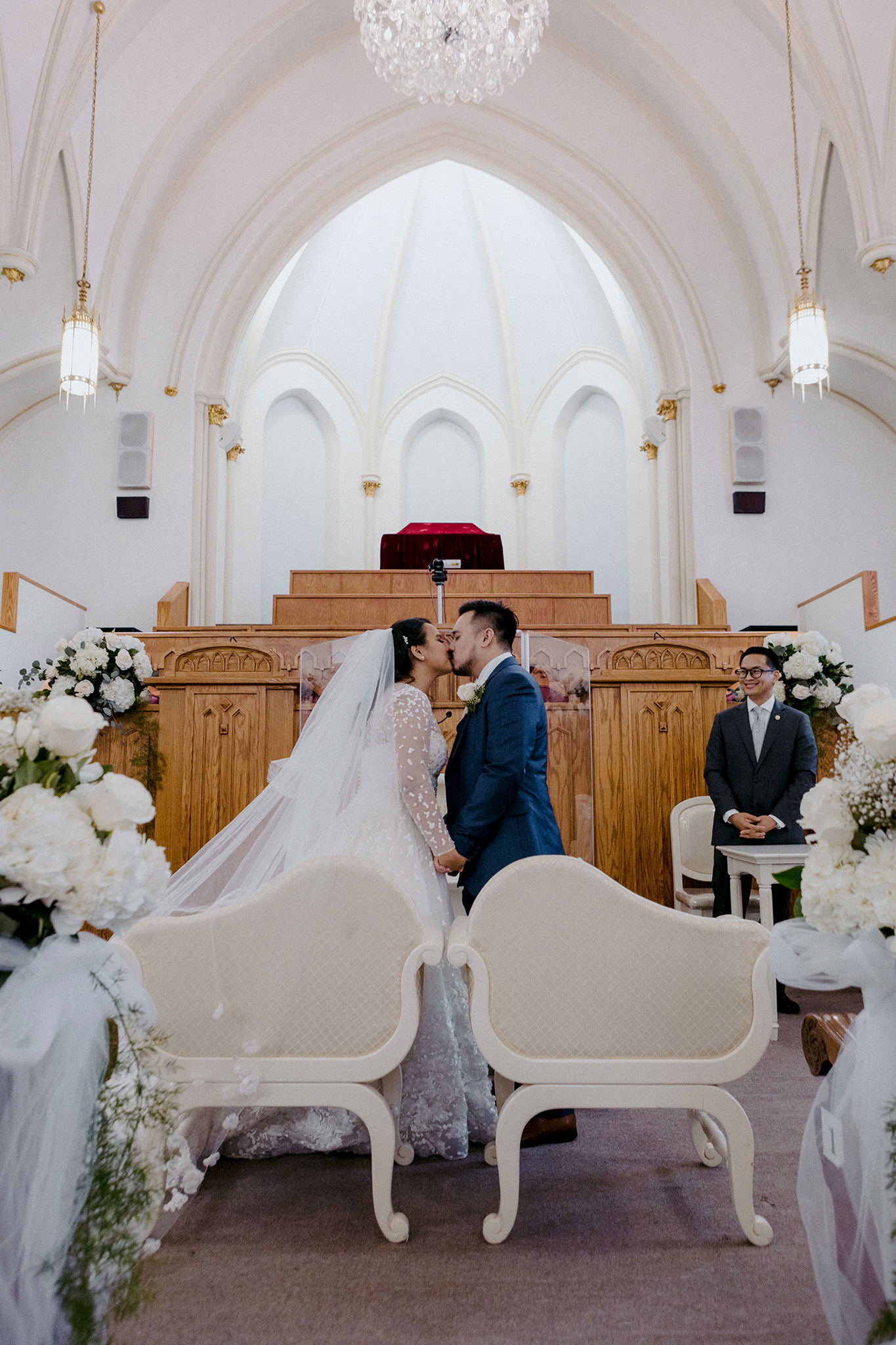 Bride and groom share their first kiss as husband and wife