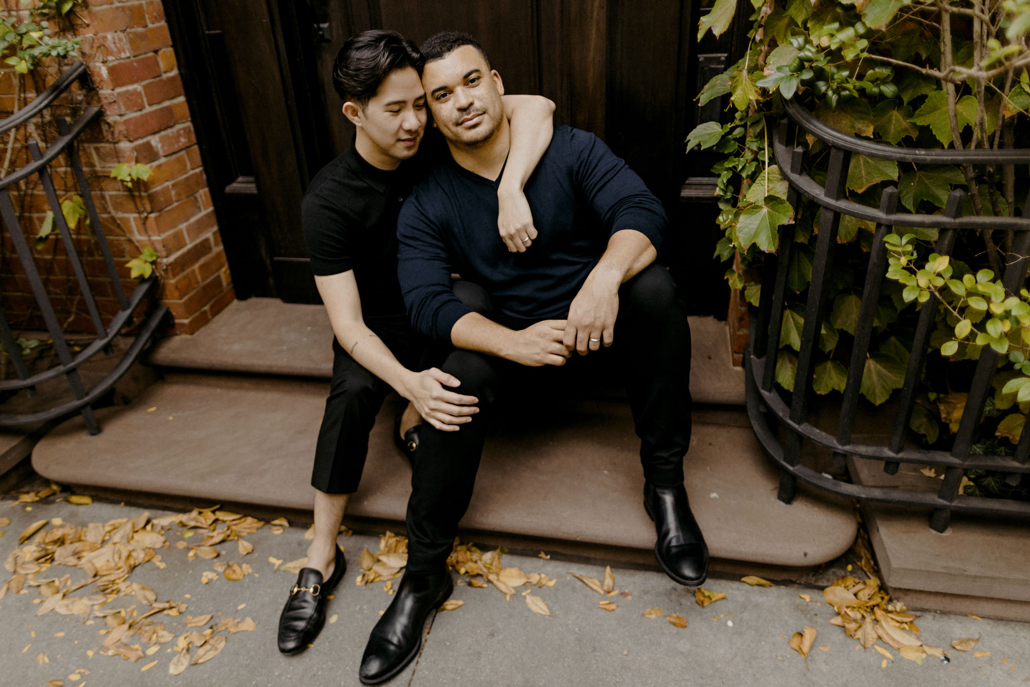 Husband and husband embrace in the West Village