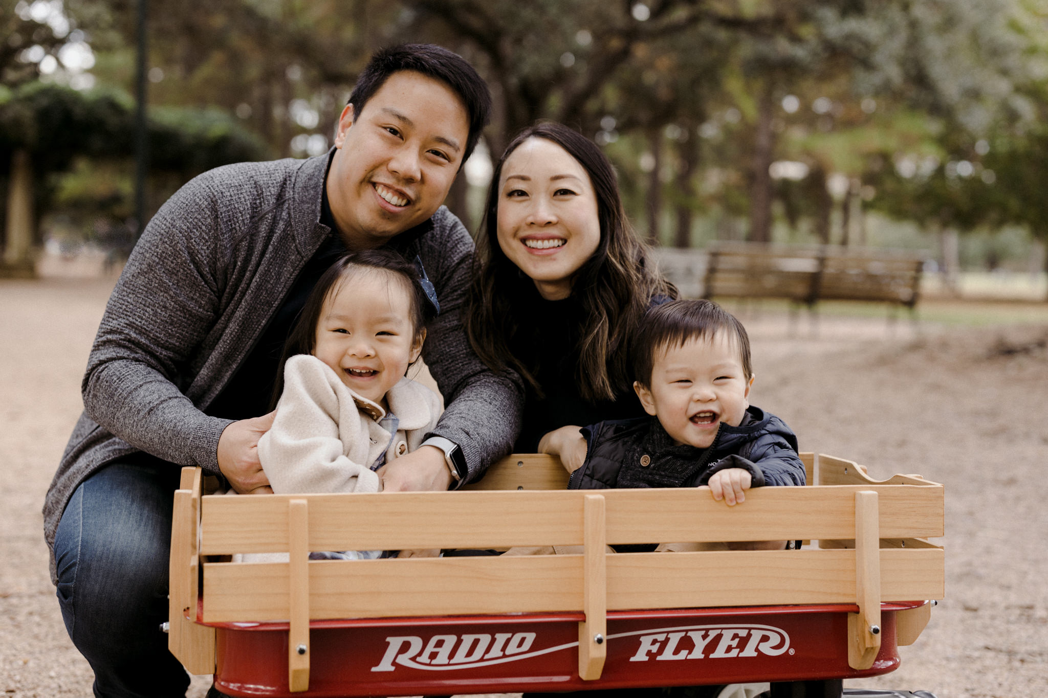Parents and their babies in a wagon