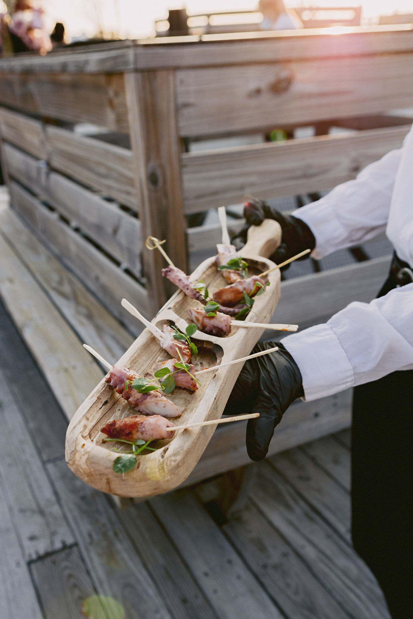 A wooden block used for serving appetizers at a rooftop wedding in Brooklyn