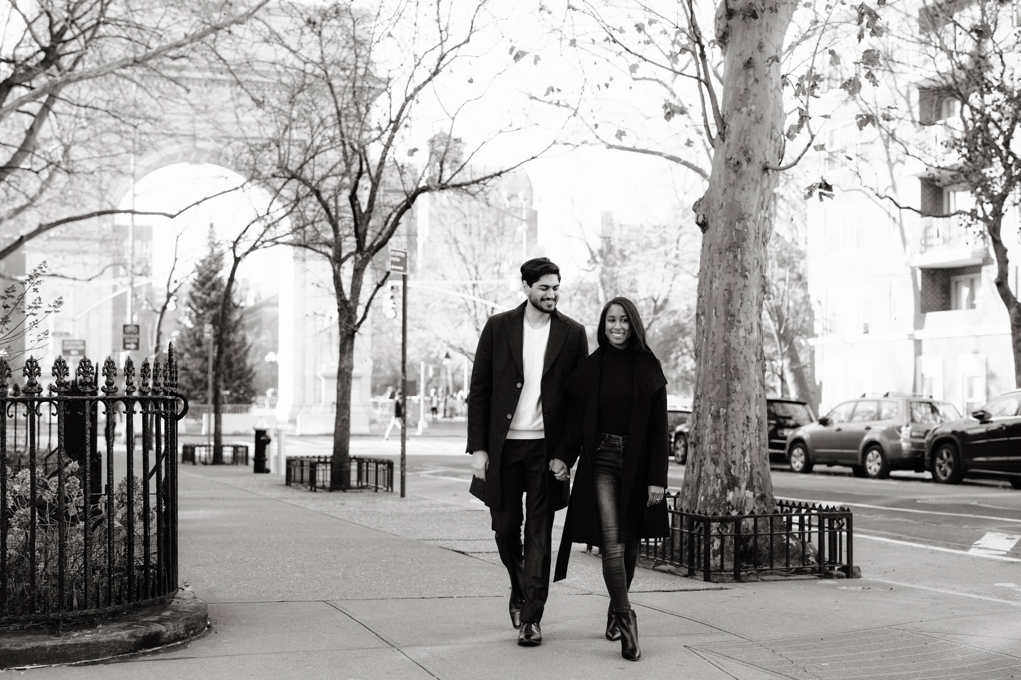 Bride and her fiancee walking down a street in New York City