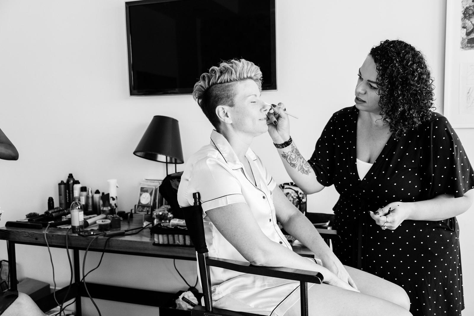 Cari Duprey doing makeup on a bride for her wedding