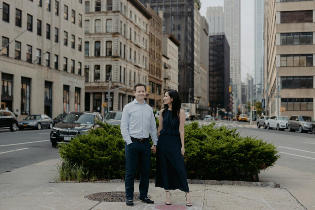 A couple holds hands outside the Roxy hotel, financial district, Tribeca