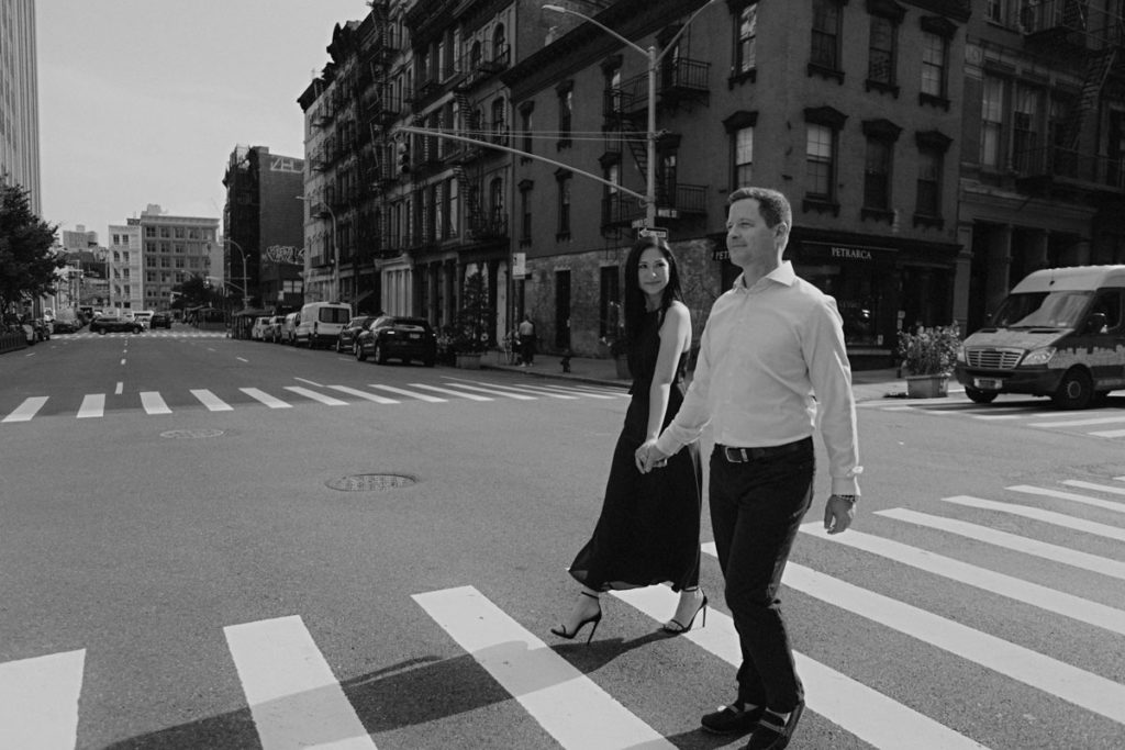 Bride and groom crossing the street in front of the Roxy hotel, financial district, Tribeca