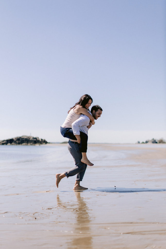 A couple on the beach for engagement photos