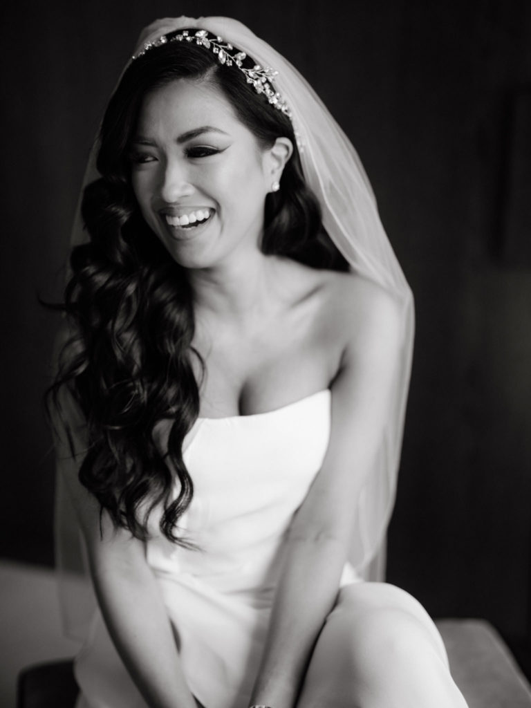 A bride laughing an smiling