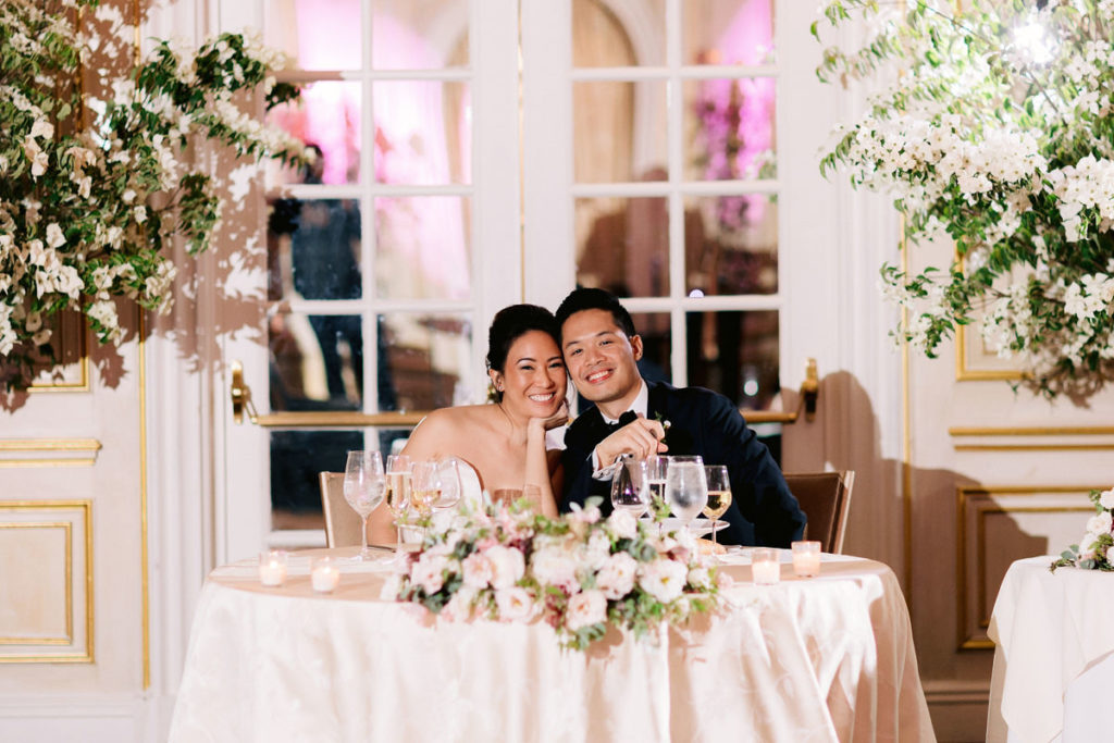 Bride and groom sharing dinner together at their wedding reception