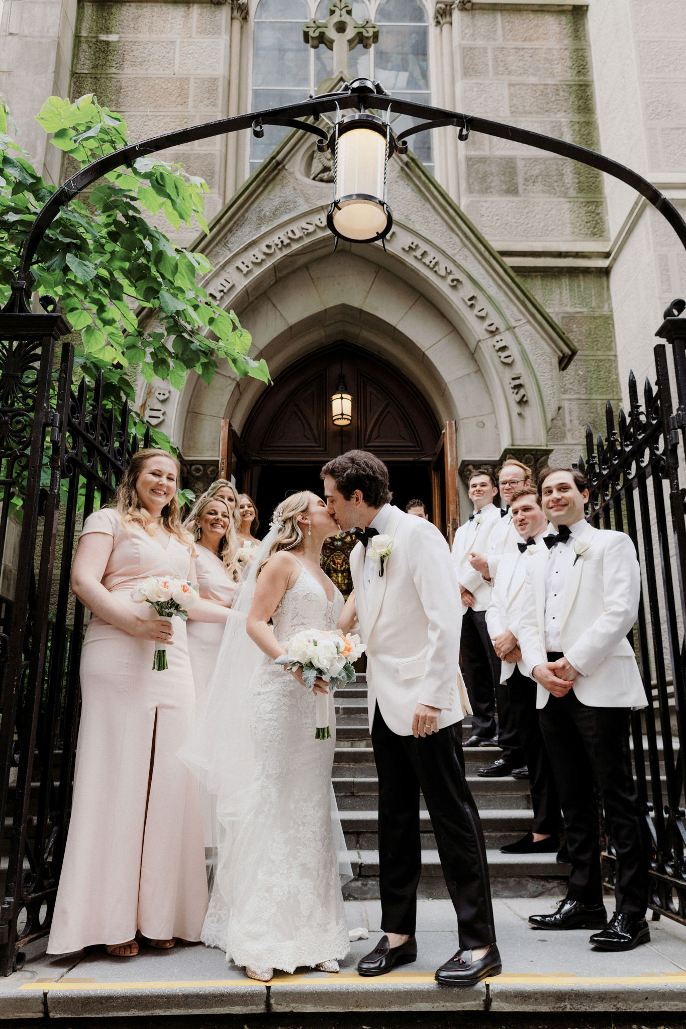 A bride and groom kiss in New York City
